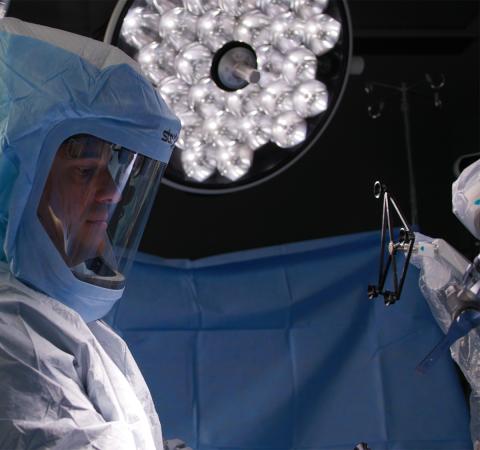 Adam Stillo standing in operating room