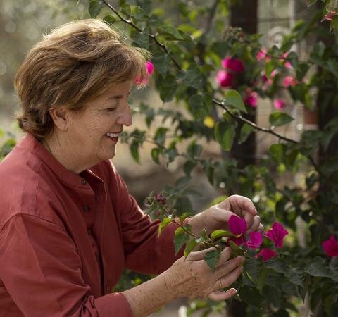 Older woman tending to garden